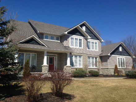 Ottawa home with asphalt shingle roof before metal roof installation